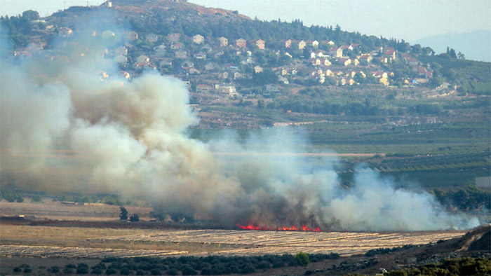 Hezbollah fires rockets, Israel strikes after attack kills Lebanon rescuers